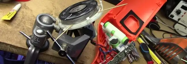 Vacuum cleaner repair parts and tools on a workbench in Sacramento, CA